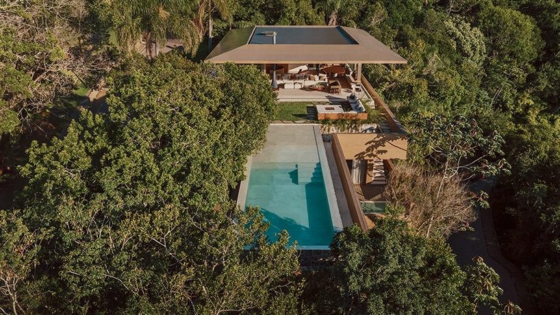 designboom's tweet image. arthur casas adapts speculative structure into wood-lined coastal house in #brazil designboom.com/architecture/a…