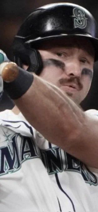 A tight closeup of Cal looking with concern into the camera after just hitting the ball at the photographer.