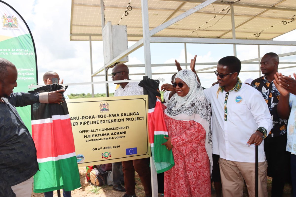 NDMA_Kenya's tweet photo. Kwale Governor H.E. Fatuma Achani today officially commissioned the Taru-Roka-Egu-Kwa Kalinga Water Pipeline Extension Project in Mackinnon Road Ward, Samburu-Kwale Sub-County.
The Governor was accompanied by Deputy Governor Hon. Chirema Kombo, NDMA Board Chairman Mr. Shallow Yahya, CEO Lt. Col. (Rtd) Hared Adan, NDMA Board Members Ms. Leah Sambai and Mr. Ahmed Bishar, Deputy Government Spokesperson Ms. Mwanaisha Chizuga, County Executive Committee Members, and National Government Administration Officers.
Implemented by NDMA with funding from the European Union @EUinKenya  and in collaboration with the @OurKwaleCounty, the KSh 24 million project provides reliable water services to communities in five villages in Taru Location, including Taru, Roka, Egu, and Kwa Kalinga. The project is directly benefiting more than 3,300 people and over 5,000 livestock.
Governor Achani described the project as a major milestone in strengthening water security and safeguarding livelihoods in Mackinnon Road Ward. She commended the collaboration between both levels of Government, noting that the intervention has significantly eased the burden of water access on families, particularly women and children, while also supporting livestock-based livelihoods that are central to the local economy.
The project was prioritised following a Participatory Disaster Risk Assessment conducted in 2023, which identified chronic water insecurity as the highest-ranked drought risk requiring urgent intervention.
Key project components include a 7.7-kilometre high-density pipeline, a 60,000-litre underground ferrocement storage tank, a solar-powered pumping system, three water kiosks, four communal water points, four cattle troughs, two motorcycles for routine operation and maintenance, and system maintenance equipment.
Deputy Government Spokesperson Ms. Mwanaisha Chizuga commended NDMA for ensuring that national government projects continue to deliver tangible benefits to citizens at the local level.