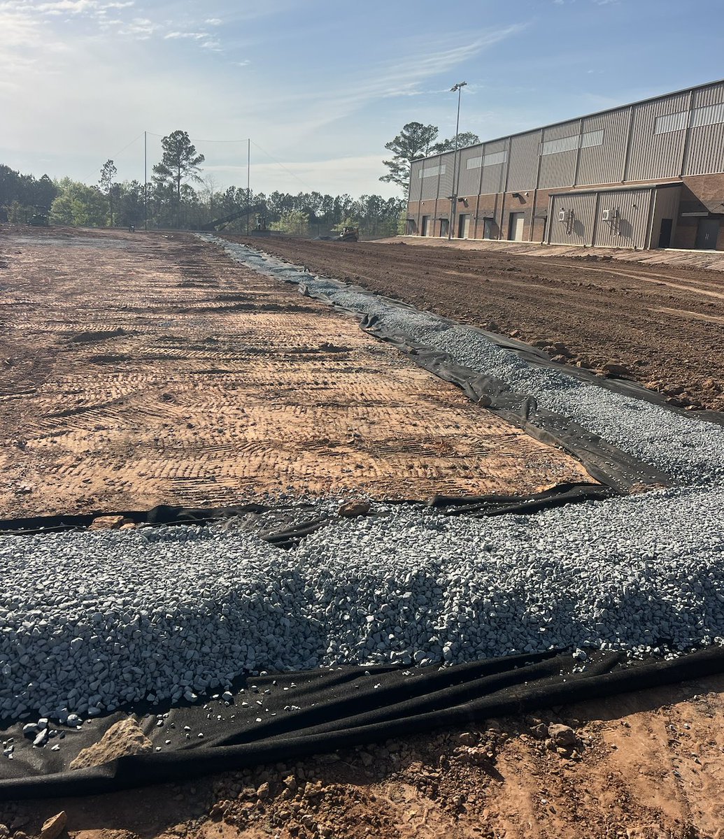 STCFieldBuilder's tweet photo. Construction continues to move forward at Thomas County Central High School. Sports Turf is currently on-site constructing two outdoor multi-purpose fields to complement the school's new indoor facility. This new facility will provide a versatile space for both the athletic and band programs for the Yellow Jackets.