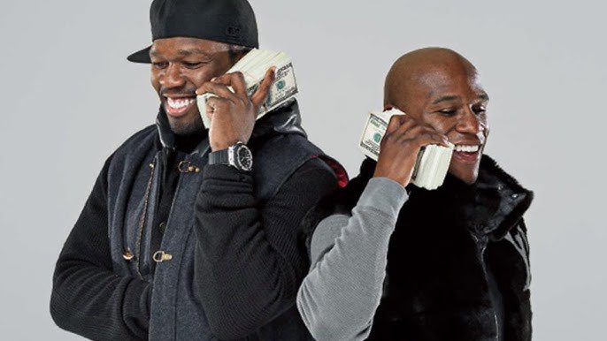 BoxingArab's tweet photo. الثُعبان فلويد برأي صديقة 50 Cent يقول انّه لا يقرأ العقود ! 🤬

صرّح فلويد أمس بأن النزال ضد ماني باكياو سيكون استعراضيًا، بينما يدّعي فريق باكياو أنه قد "وقع بالفعل عقدًا لنزال احترافي" بل وحصل على دفعة مقدمة.

يطالب فريق مايويذر الآن بإعادة تصنيف النزال من نزال احترافي معتمد إلى نزال استعراضي، وهو ما يعتبره فريق باكياو أحد انتهاكات العقد العديدة:

"كان لدى فريقه جميع الأوراق اللازمة. لقد وقّع جميع العقود وحصل على دفعة مقدمة. لدينا تأكيدات DocuSign، بالإضافة إلى توقيعات بخط اليد مع رقم تعريف جهازه وعنوان IP الخاص به - كل شيء موجود."

وبالتالي، فإن النزاعات القانونية والتفاصيل المالية هي التي تعرقل حاليًا عرض النزال على نتفليكس، ولا يزال إقامته موضع شك.

مباراة استعراضية ومباراة احترافية حقيقية أمران مختلفان تمامًا (خاصةً من حيث الاهتمام بالمباراة ونجاحها التجاري المحتمل)، ومن غير الواضح كيف يمكن أن ينشأ هذا التباين أصلًا.