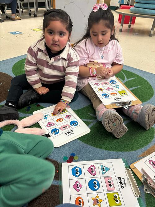 WashingtonD50's tweet photo. Ms. Luna's class sharpened up their shape identification skills during a few fun rounds of Shape BINGO. 🟪🔵🔺💛 #BINGO #Shapes #LearningThroughPlay #TheWashingtonWay https://t.co/caeyIxGls0
