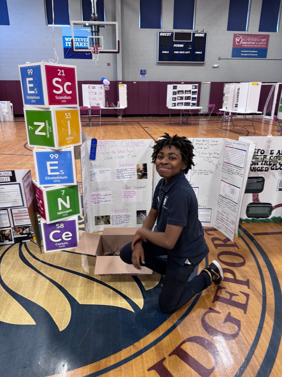 achievement1st's tweet photo. Congrats to DeAndre, an 8th grader at AF Bridgeport Middle, for winning his school science fair and advancing to States! 🏆🥼

He engineered a haptic glove to help people who are visually impaired detect obstacles, building it with sensors, wiring, and motors. https://t.co/SQuTVCV9BZ