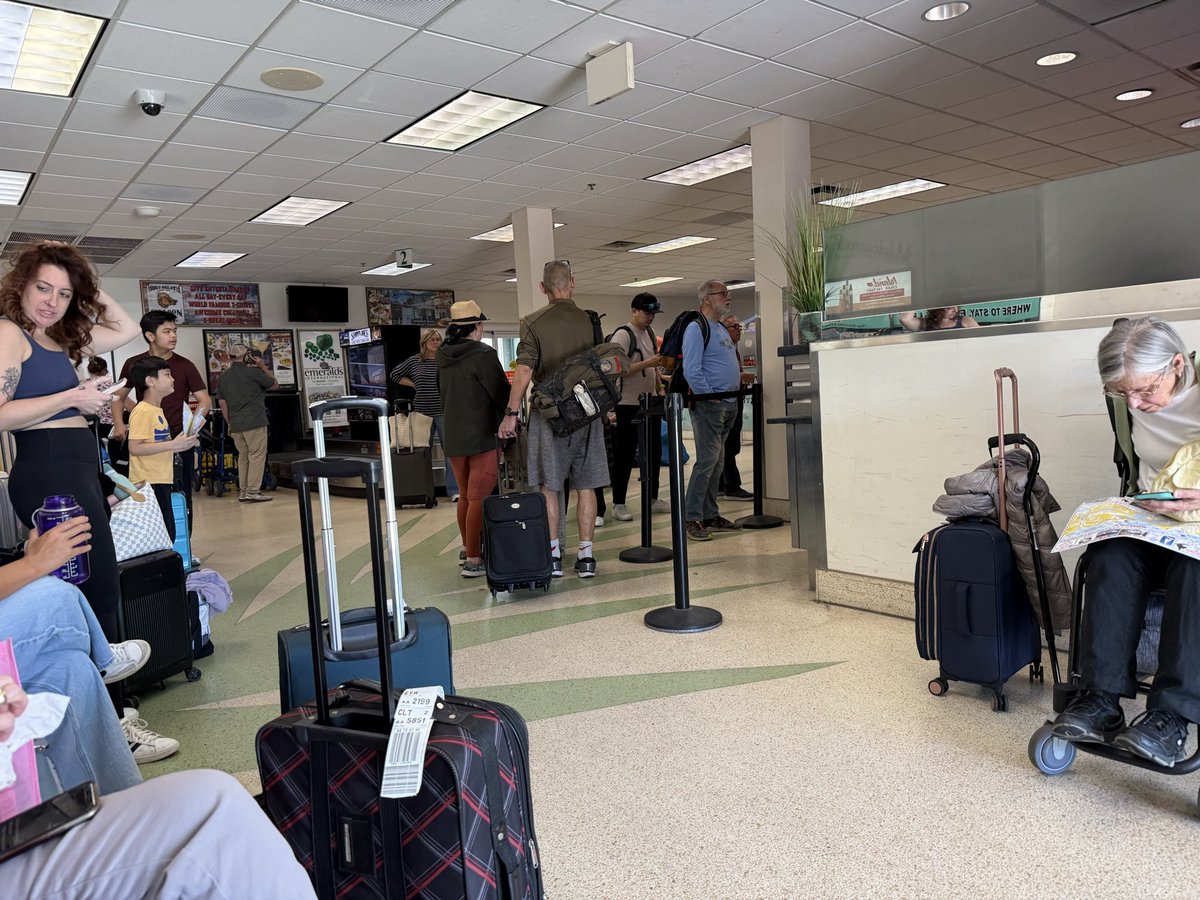 treebaa's tweet photo. @Budget in Key West car rental has no cars despite “reservations” and few seats. Travelers sit on the mothballed bag carousel. https://t.co/EtyTD7ZET7