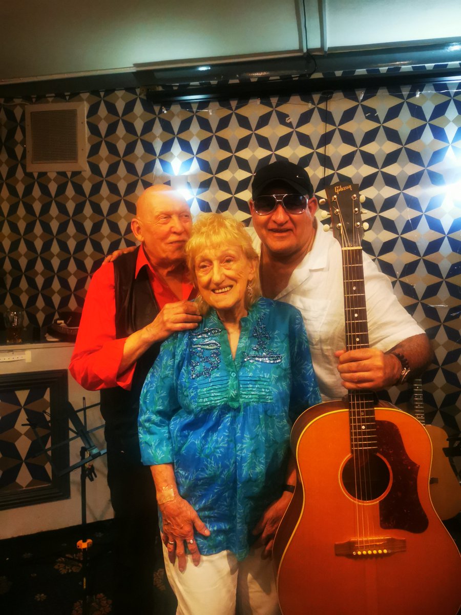 BluesmanMikeF's tweet photo. @edwinofficially @TonyRyanJnr @HenshallAlfie Found this pic with Dai &amp; Barbara Thomas, #Manchester scene legends, with said axe formerly owned by the late Pete Ryder in 2025 before my lil accident. Last show I played before it I think (?) 💪🏿🫣🤛😎🌵
#KeepinItLive with #Play2All #TogetherWeCanWinThis &amp; #StopTheClosures https://t.co/TFt9fUbjHC