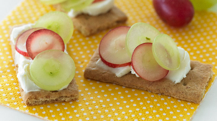 I can't really explain why but I didn't wake up particularly hungry today. So I settled on just snacking for breakfast.  I made one of my gram's classic snacks, Graham Cracker Grape Sandwiches!