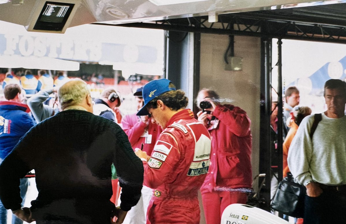 HRiddler's tweet photo. @McLaren the late, great Ayrton Senna signing a @TAGHeuer cap at @SilverstoneUK. He was kind enough to give him his ear plugs too, straight out of his ears! An absolute gentleman. #formula1 #mclaren #ayrtonsenna #silverstone #silverstonegp https://t.co/9a3a7hpumr