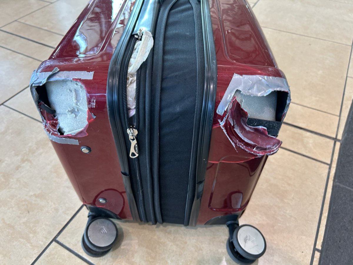 smclaughlin33's tweet photo. @AlaskaAir there were minor cracks around the wheels, which I had reinforced w/ duct tape (so not saying it had much life left in it) but to rip the wheels off &amp; cause big damage? Your team in San Diego didn’t even say sorry. Just “we don’t cover normal wear and tear.” You suck. https://t.co/KV8k0mYBpx