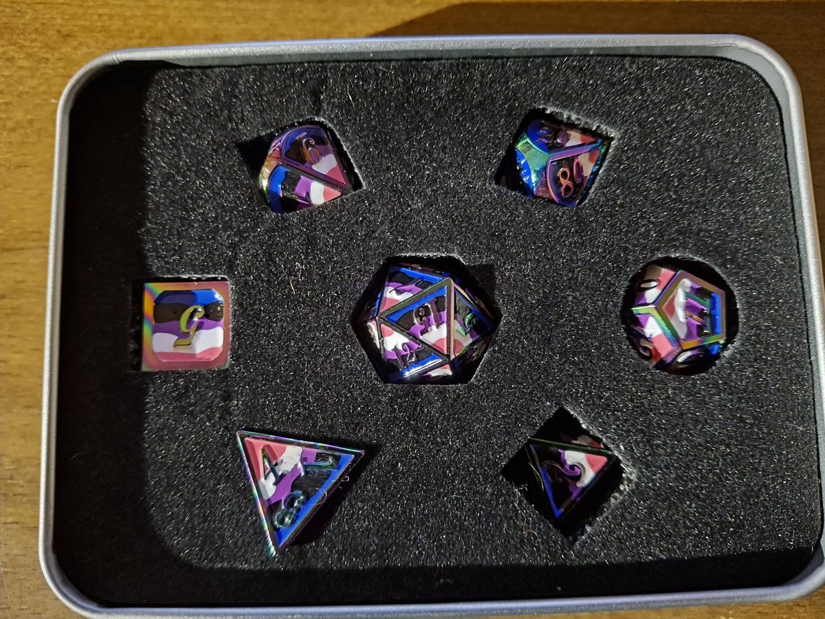 Mariah_Mortimer's tweet photo. YO LOOKIT WHAT I FOUND

After our D&amp;D session earlier today, a friend &amp; I went to a game store so they could get some paint for their miniature. Me being a little dice goblin, had to go look at the shiny math rocks.
And what a find! 😁 https://t.co/gAOfrOuiYj