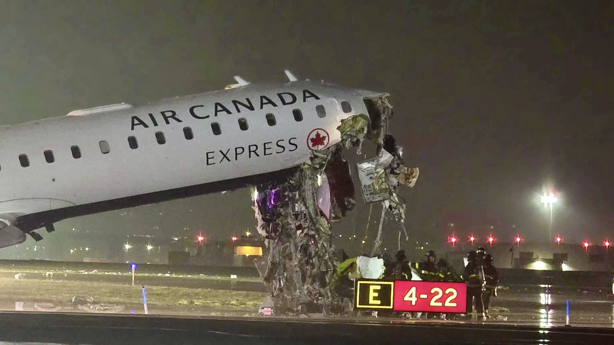 SLCScanner's tweet image. Heavy damage to the front of the #CRJ900 that collided with a fire truck on runway 4 at #LaGuardia airport. Fatalities are being reported. Listen to the audio and you can hear the tower give permission for the Fire Truck and company to cross runway 4 then tells him to stop.