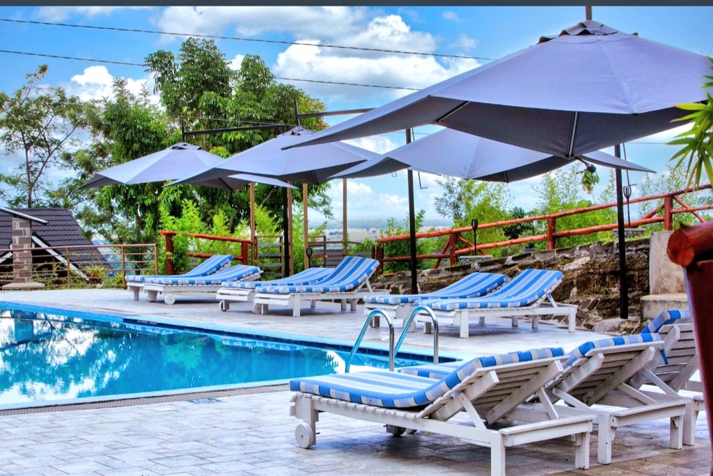 A good afternoon from <a href="/Kyangabi_Resort/">Kyangabi Crater Resort</a> 
This resort alone has 61 rooms which can accomodation about 200 people While there,you can enjoy some outdoor activities, gym, twin lake

Single rooms go for 450k per person per night Full board
Couples/Double at 800k per night Full Board