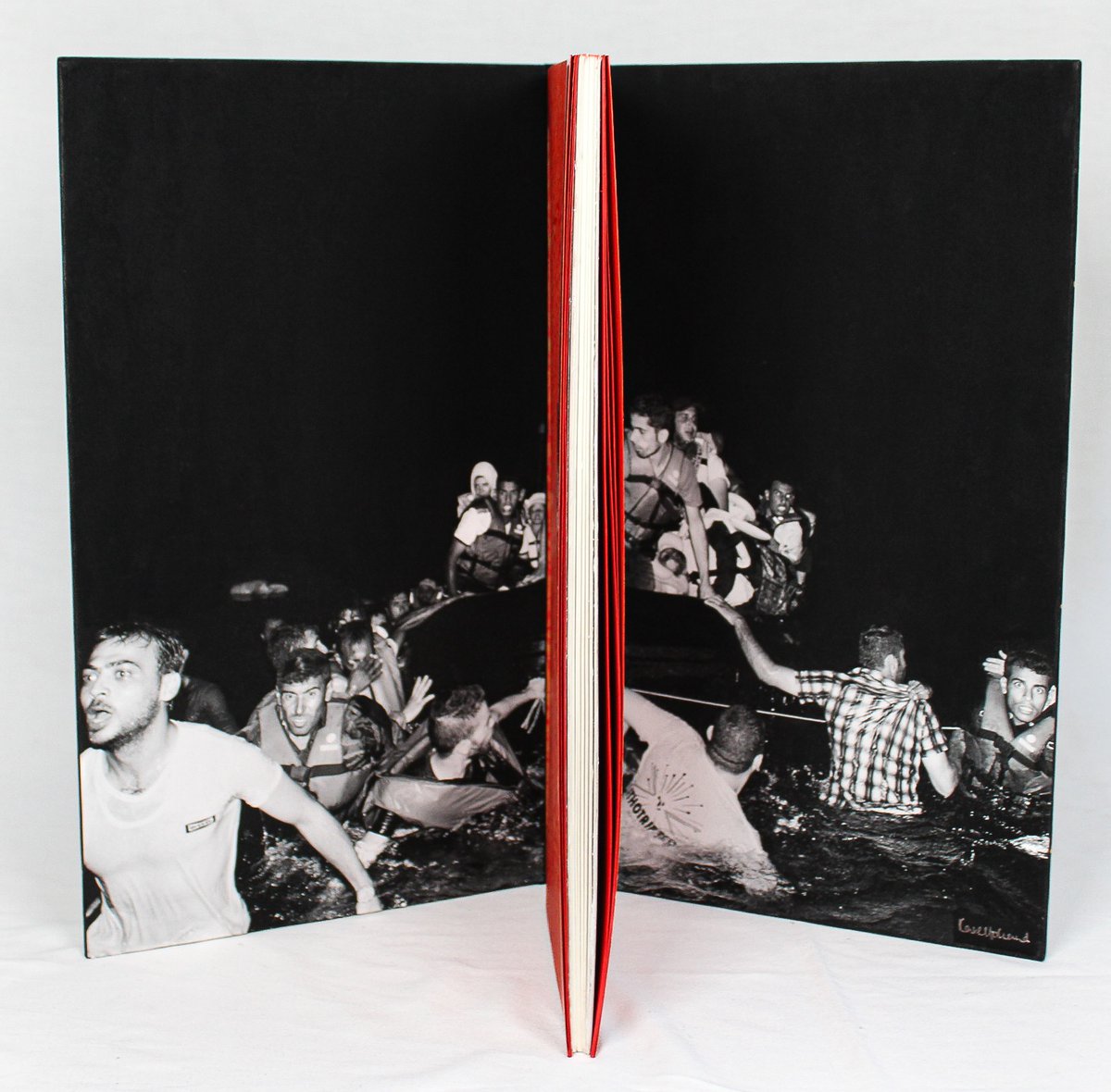 LuxMentis's tweet photo. Kate Holland binding on Peter Koch's, Fragments of Parmenides. Photograph inside depicts refugees making the same crossing from Turkey to Greece nearly 2500 years later that Parmenides’s family made.  #nyabaa26 #booktok #rarebooks #finepress #designbinding #artistbooks #bookarts https://t.co/kbpU5VXch0