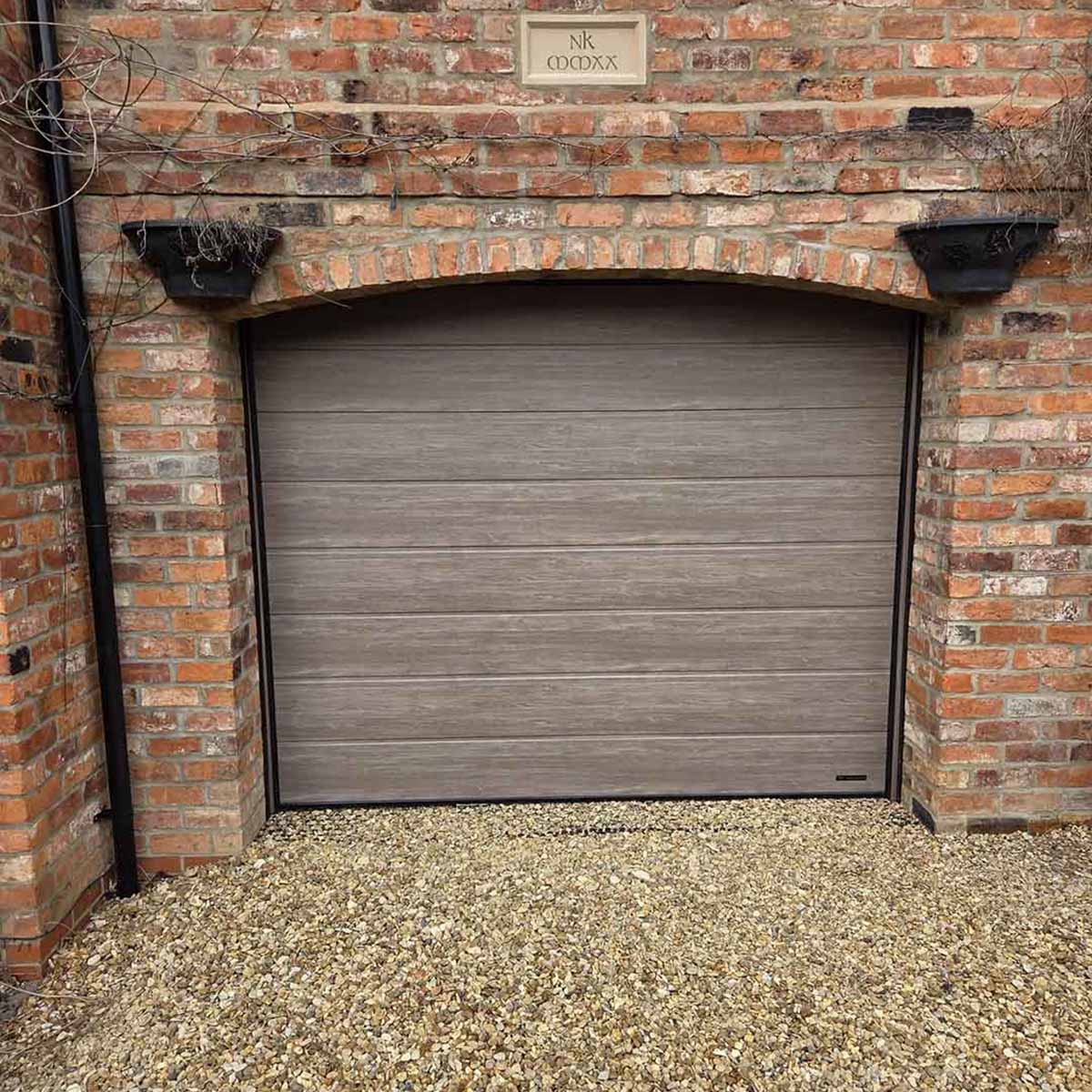 easterngroupuk's tweet photo. A great example of how adaptable a #sectionalgaragedoor can be. Our recent installation in Harmston, Lincoln fits seamlessly into an arched opening - a versatile solution ideal for arches, angled reveals, and other non‑standard layouts. https://t.co/vnBAIrQzDH