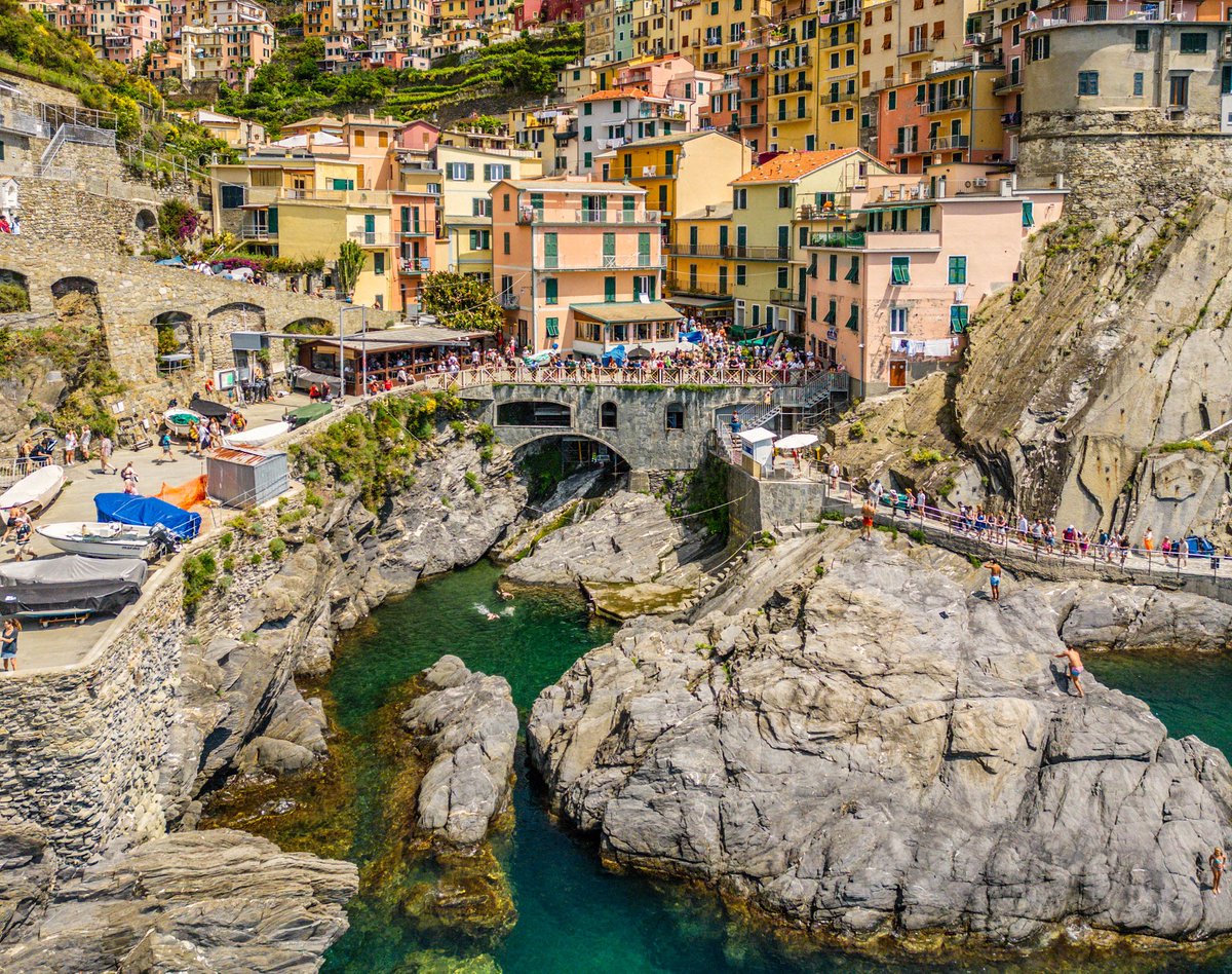 Summer in Manarola: istockphoto.com/portfolio/bob_… #Europe #Italy #Manarola #CinqueTerre #Mediterranean #sea #town #village #tourists #summer #vacation #destination #crowds #boats #cliffs #architecture #history #colors #aerial #view #gettyimages #travelpics #travelphotos #coast #bridge