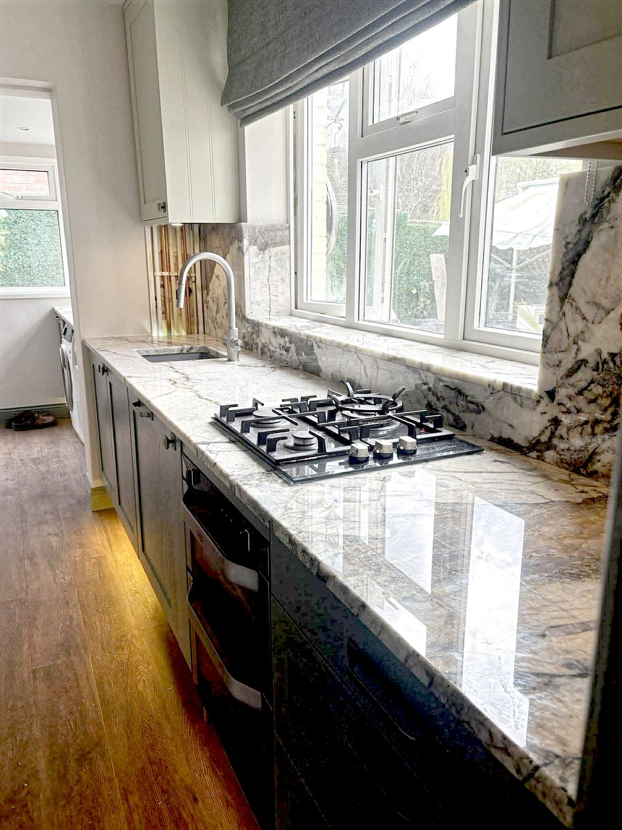 MarbleGDesigns's tweet photo. For this project, we didn't just stop at the worktops; we extended the Patagonia Crystal up as wall cladding and across the window sill. Matching those wild, chaotic veins across different planes requires exact templating and a lot of patience. Worth it. https://t.co/MdC6XDys1m