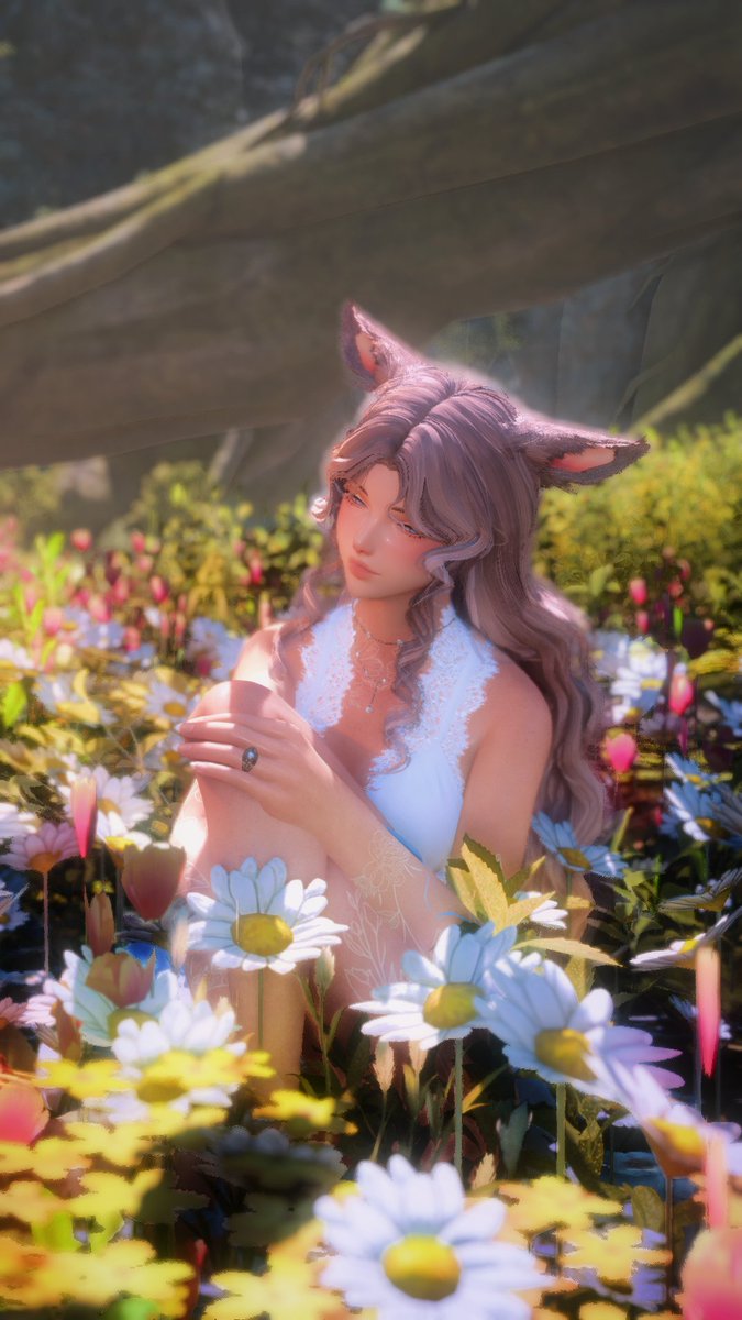 A closup, she just looks so pretty in the flowers 🥹