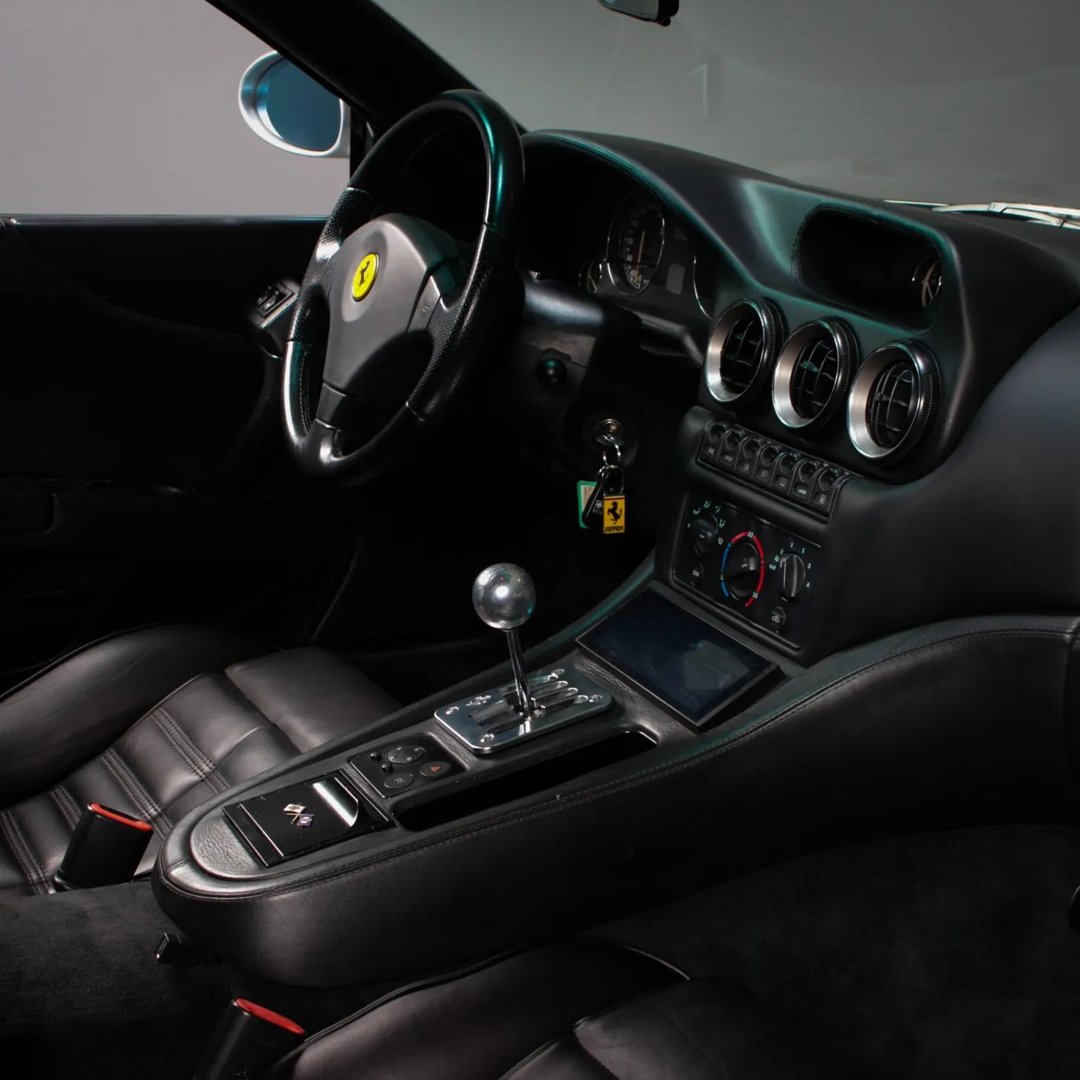 Bringatrailer's tweet image. This 1998 Ferrari 550 Maranello left the factory finished in Argento Nurburgring over Nero leather specified with a 5.5-liter F133A V12 linked to a six-speed manual transaxle and a limited-slip rear differential. Showing 70k Kilometers, it's listed now in Sneek, Netherlands, on