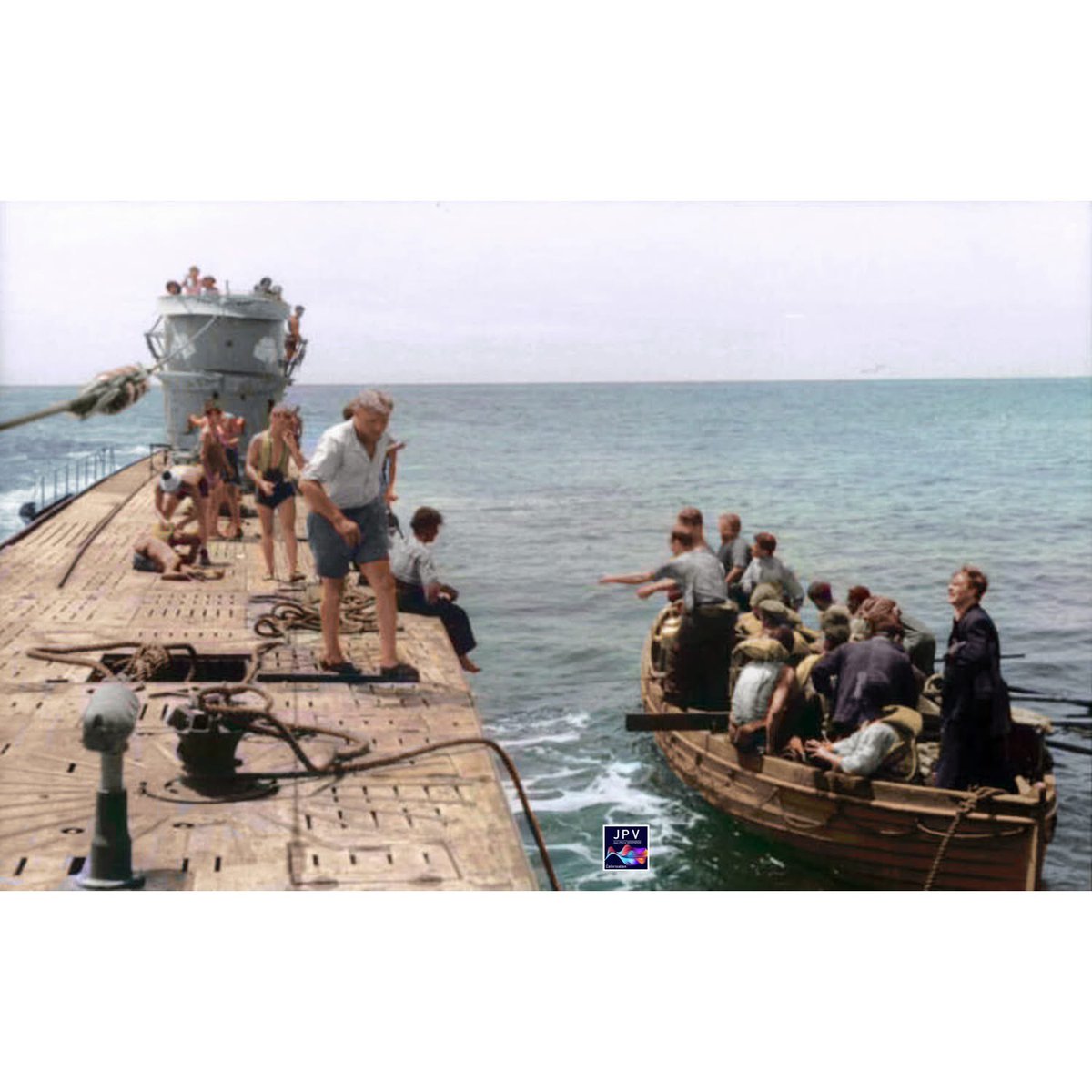 Type IXB U-107 rescues a ship’s crew in a lifeboat after sinking their vessel, Atlantic Ocean, June 1941.