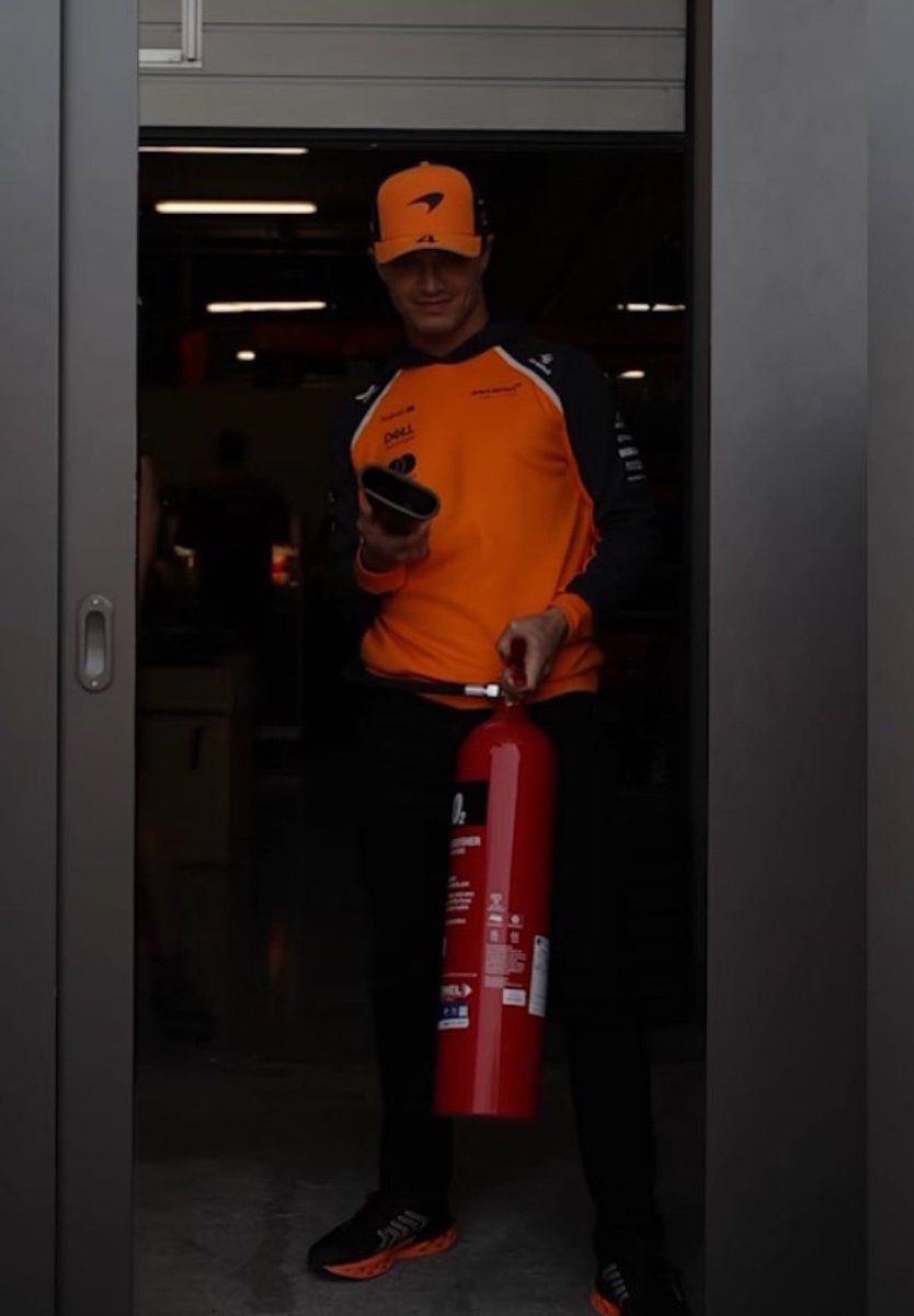 ln4norris's tweet photo. firefighter lando in suzuka last year https://t.co/IZKBEDPfDy