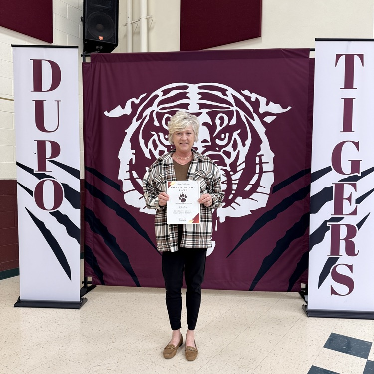 Dupo196's tweet photo. We are Tiger Proud to announce that Kellie Kloess, our Jr-Sr High Library Aide, was recognized at the March Board Meeting with the "Power of the PAWS" award! 🌟 #Dupo196 #TigerPride #PowerOfThePAWS #SchoolLibrary #STEM #CommunityStrong https://t.co/41PbTGUIbv