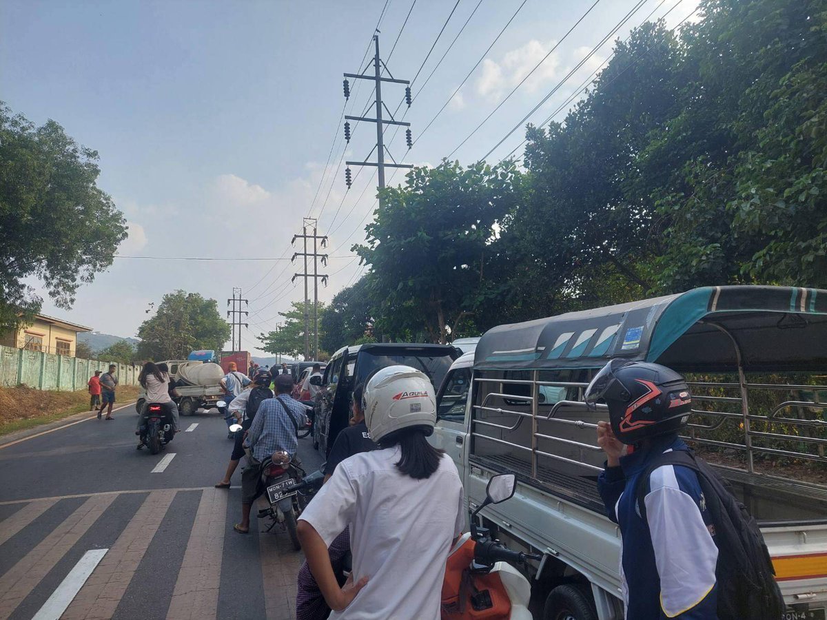 HURFOM's tweet photo. Residents across Mon State are facing a worsening fuel crisis, as the Junta has failed to manage shortages effectively and has instead intensified restrictions and enforcement measures. In recent weeks, authorities have arrested fuel station owners, accusing them of violating distribution rules, further disrupting supply and increasing fear among local businesses.

The fuel shortage has been compounded by restrictive policies imposed by the Junta, including an odd-even vehicle system and a QR code requirement for fuel purchases. While these measures are presented as solutions, residents say they have instead deepened the crisis, fueled corruption, and created barriers for ordinary people, particularly low-income households and emergency service providers. Many are now forced to buy fuel on the black market at more than double the official price.

Since early March 2026, access to fuel has become increasingly limited. Residents report long waiting times, strict purchasing limits, and irregular opening hours at fuel stations. In many cases, people must queue for hours, sometimes overnight, only to find that supplies have run out. Diesel shortages are especially severe, with some drivers waiting since early morning without success.

On March 22, the Junta announced additional restrictions, stating that fuel would only be sold once or twice a week depending on vehicle type. Further limits were imposed on how much fuel can be purchased, with small allocations for motorbikes and restricted quantities for passenger vehicles and trucks.

As a result, transportation services have been significantly disrupted. Some operators have reduced the number of vehicles in service due to fuel shortages, while fares and delivery costs have sharply increased. A transport operator explained that securing fuel has become extremely difficult, forcing them to cut trips and raise prices. “Because of fuel shortages, we cannot operate as usual. Costs have increased. For example, transporting goods that used to cost 8,000 kyats now costs around 10,000 kyats,” he said.

Travel delays have become common, as drivers must stop frequently to search for fuel or wait in long lines at stations. This has affected not only passenger transport but also the movement of goods, contributing to rising prices and limiting access to essential items.

The crisis has also accelerated the growth of the black market. With official supplies restricted, many people are forced to rely on informal sellers, where prices are significantly higher. On March 25, black market fuel prices ranged between 16,000 and 21,000 kyats per unit, according to residents in Mawlamyine. “Most people wake up at 4 a.m. to queue for fuel. If they cannot get it, they have no choice but to buy from the black market,” said one resident.

There are also increasing concerns about corruption. Some fuel stations are reportedly diverting supplies to the black market for higher profits, while limiting sales to the public. At the same time, individuals are taking advantage of the situation by queueing for fuel and reselling it at inflated prices.

Restrictions requiring proof of vehicle registration and limiting purchase amounts have further pushed people toward informal markets. As a result, key sectors such as agriculture, fisheries, and transportation are increasingly dependent on black market fuel to continue operating.

At present, official fuel prices range between 3,300 and 3,500 kyats per liter for petrol, and between 4,000 and 4,300 kyats per liter for diesel. However, these prices remain largely inaccessible due to ongoing shortages.

The Junta has also begun enforcing compliance with its rationing system through punitive measures. In Mawlamyine, nearly 18 individuals have reportedly been penalized for violating the odd-even vehicle rule. Authorities have warned that those who fail to comply may face charges under Section 188 of the Penal Code, which carries penalties including up to one month in prison, fines, or both.

Residents say the Junta’s response has not resolved the crisis but instead worsened conditions on the ground. Rather than ensuring fair distribution, current policies have increased hardship, enabled corruption, and deepened inequality.