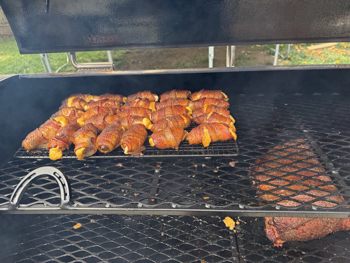 BensTableCloth's tweet photo. I’ve been doom scrolling so I have decided to share some of my camera role before my day job is back in season. 

Poppers.  Simple.  The trick is to roll the bacon tight and place it on a wire cooking rack instead of using toothpicks to secure it (see photo).  

I use an offset or Santa Maria style grill so cooking temps/times are subjective.  Yes, an oven will work too. Just don’t use sugar to season, unless it’s in the cheese filling or at the end but just long enough to caramelize 

I don’t care what you put inside, as long as it’s cheese, jalapeños and bacon….it’ll be delicious