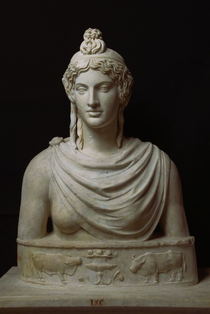 Female Head, restored as Isis. Roman, 2nd cent. CE. Marble. 📷Galleria Borghese. Bust not considered original, base likely Renaissance design.

The figure wears a small cloak held by a fibula over the right shoulder. Her hair is bound with a diadem.