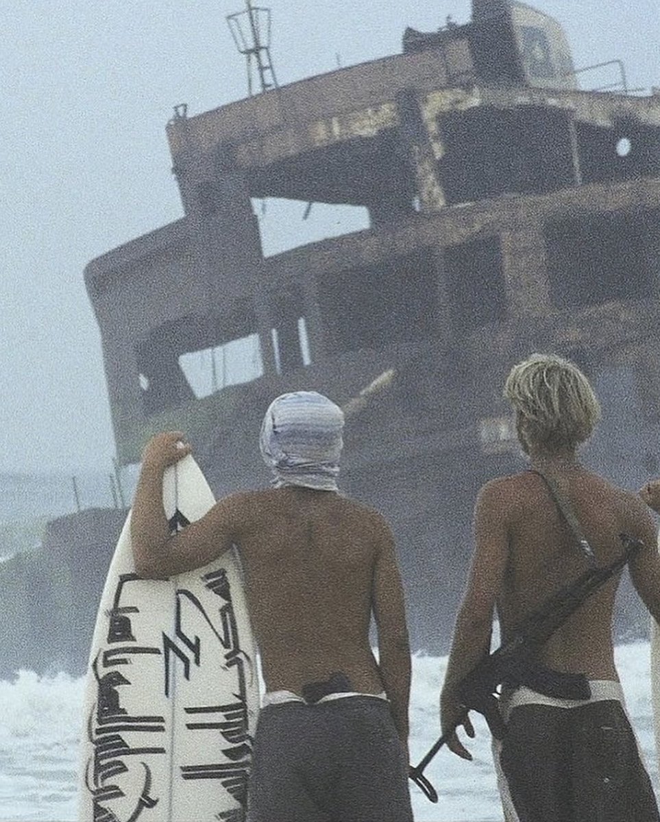 blackstarops's tweet photo. chas smith surfing in yemen in the early 2000s, shortly after the 9/11 attacks https://t.co/MEoYyYKVoC