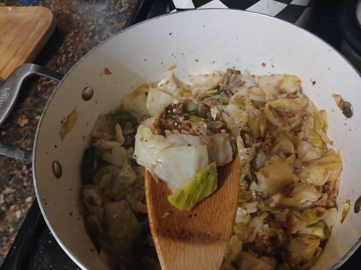 Veggie night! Cooked cabbage with bacon and roasted veggies (asparagus, onion, tomatoes, golden taters) served with white rice.