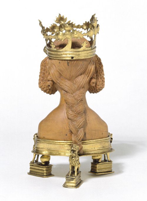 Head of a young female saint, carved in boxwood with gilt copper crown set with garnets and amethysts, possibly Dijon, c. 1380-1400.  The hair here is exquisite.  (V&amp;A Museum, London)