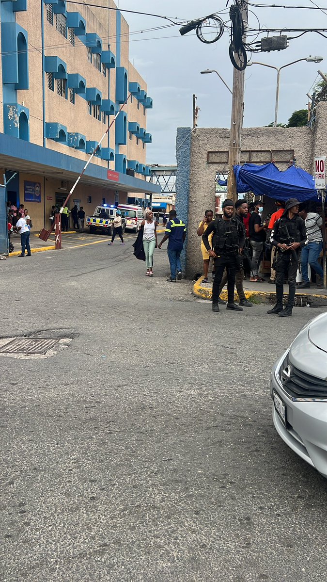 Raggahmufinzent's tweet photo. NOW: Crime scene along North Street. Man gunned down at the parking lot adjacent KPH in Kingston. Sources believe it is stemming from the extortion over said parking lot. Gunshots rang out sending people scampering for cover a short while ago #Wednesday #March #Jamaica https://t.co/ZNDsn2QYLQ