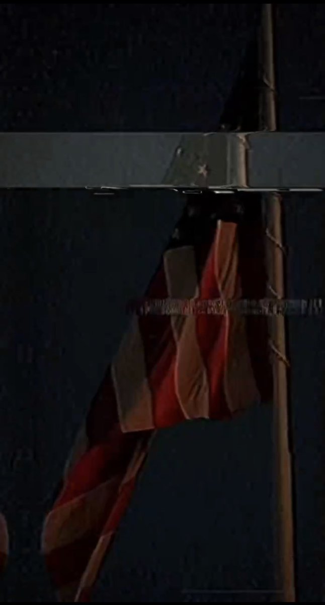 sentdefender's tweet image. Another cryptic video just posted by the White House, featuring static obscuring a drooping American Flag.