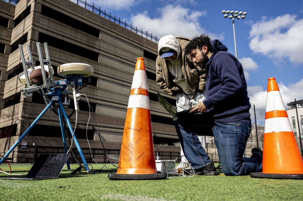 Northeastern's tweet photo. Huskies in action ⚙️ 🏈 

Engineering students test their capstone project, a fully autonomous football-launching machine, on Carter Field. https://t.co/CjxcJmJzK2