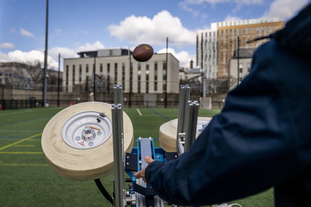 Northeastern's tweet photo. Huskies in action ⚙️ 🏈 

Engineering students test their capstone project, a fully autonomous football-launching machine, on Carter Field. https://t.co/CjxcJmJzK2