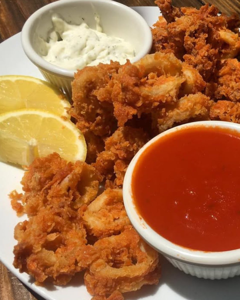 Crispy, golden, and oh-so-delicious! 🦑✨

Start your meal with our Calamari Fritti - perfectly fried and served with a zesty dipping sauce to kick off your dining experience.