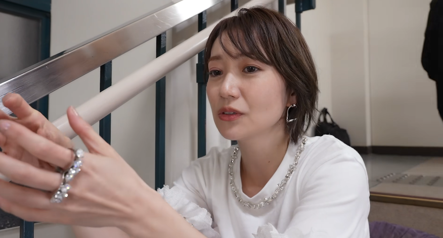 48RequestHour's tweet photo. From AKB48's 20th Anniversary Documentary:

Oshima Yuko: "AKB48 in the past was very individualistic. I think the goals were really clear and easy to understand. Things like 'Budokan', 'Tokyo Dome' or 'Reaching #1 with this Single', they were very straightforward.

For the current members, it's harder. Figuring out clear goals and working toward them. During our time, we already did most of these things. Even so, I think the girls who join still geniunely want to become idols in AKB48. So an AKB48 made up of girls who truly want to be idols, who truly want to be AKB48, is a very strong dream to have. 

Compared to us, I think they have even stronger attachment and love. Together with our memories of the 20th Anniversary and of the past, it feels they are embracing and carrying all of that within them. 

That's why I think this is a new, original form of AKB48."
