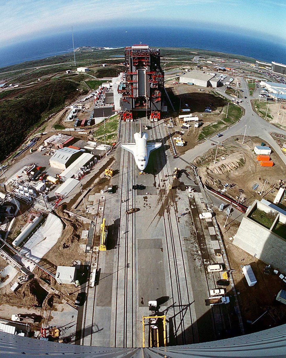 Boneyardsafari's tweet image. Here is Orbiter Enterprise OV-101 moving toward the shuttle assembly building at Space Launch Complex Six in Feb 1985.  Behind the shuttle are the payload changeout room and the payload preparation room. #enterprise #ov101 #nasa #boneyardsafari #aviationsafari