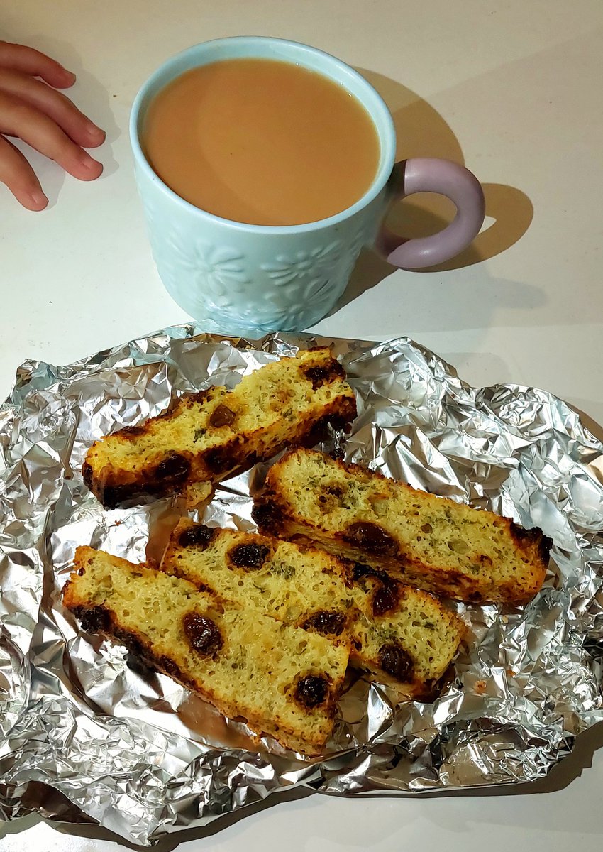 Breakfast this morning was toasted Greek Easter cheese cake with a nice cup of English breakfast tea. 
The little hand there belongs to my nearly 3 year old daughter who's waiting patiently for a piece of yummy delicious cheesecake 😋 🥰