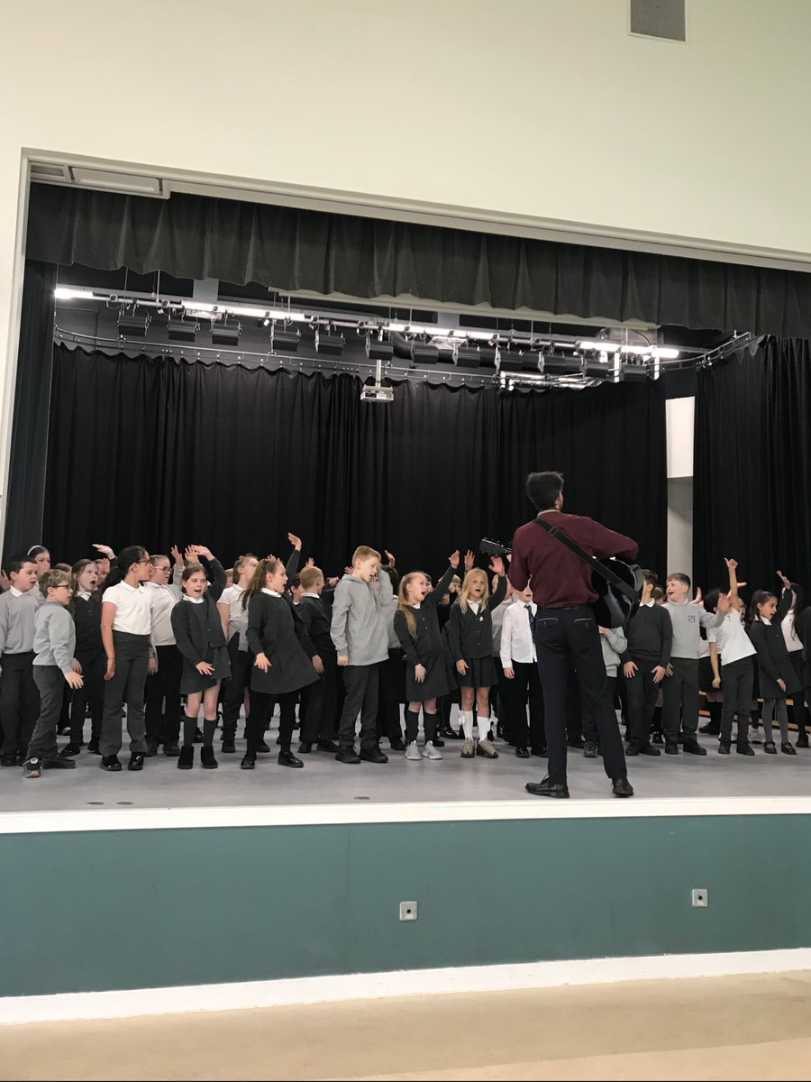RSNO's tweet photo. On Wednesday our Dundee Community Singing Leader, David McLean, led youth singing workshops for local primary schools in partnership with Instrumental Music Services Dundee @DCCmusicservice 

Pictured is St Andrew's Primary School enjoying themselves on stage! https://t.co/tO7dfxzx2T