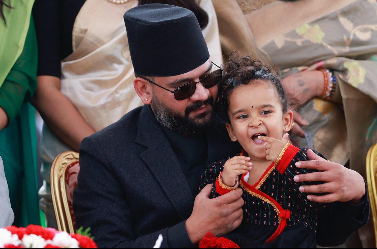 Newly appointed Prime Minister Balen Shah holds his daughter during a group photo session after the swearing-in ceremony at the President’s residence in Kathmandu, Nepal, on Friday, March 27, 2026.