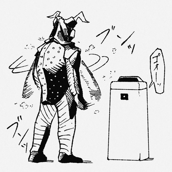 空気清浄機の前で花粉を吸ってもらおうとするゼットン 