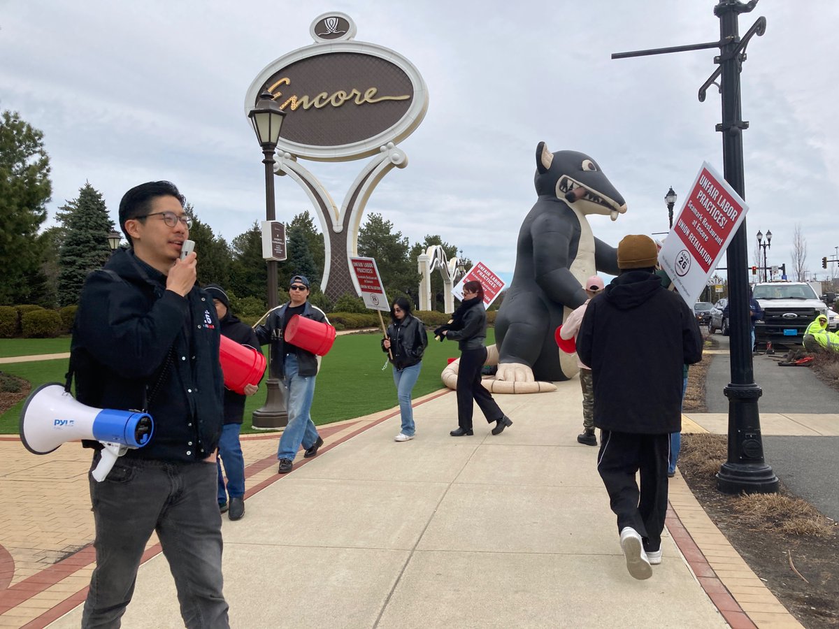 UNITEHERE26's tweet photo. Happening now outside Encore Boston: Seamark workers — with special guest Scabby — are picketing because Carver Road Hospitality, the restaurant’s owner, has engaged in unfair labor practices! #ULP https://t.co/Mkr0epQGmv