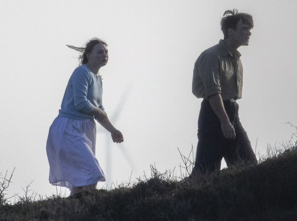 Cillian Murphy and Mia Threapleton filming Damien Chazelle’s upcoming untitled film.