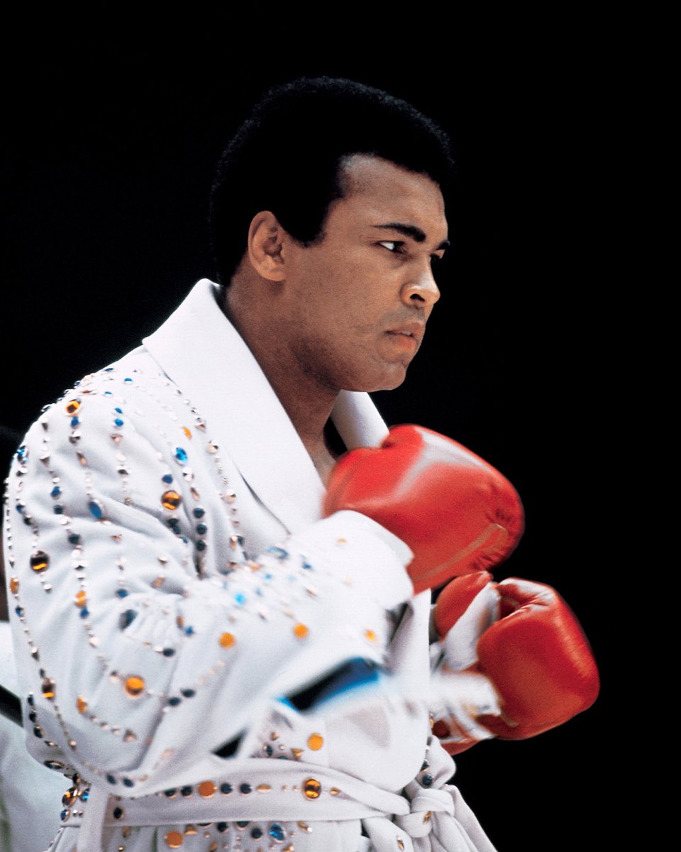 MuhammadAli's tweet image. A closeup of Muhammad Ali before his fight vs Ken Norton at the San Diego Sports Arena. Fun fact: the robe in the photo was gifted to Muhammad by Elvis Presley.

San Diego, CA 
3/31/1973

📸: @LeiferNeil 

#MuhammadAli #Icon #Champion #KenNorton #BoxingHistory #NeilLeifer