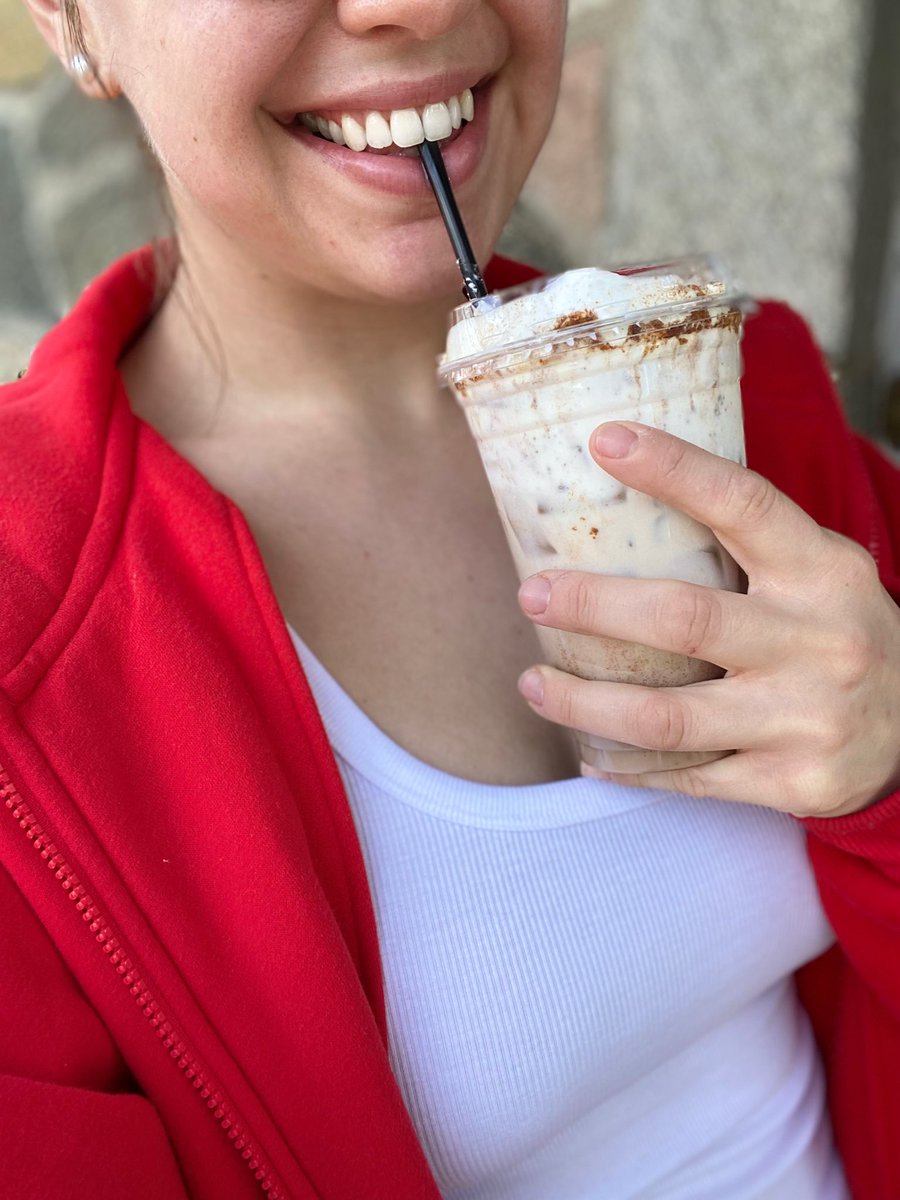 Face glowing w/ an iced blueberry muffin chai in hand. Happy Friday 💙☕️