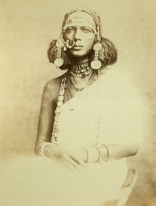 General view of Khartoum
portrait of a member of the Khartoum elite, named as Kadi of Khartoum
portrait of a seated woman wearing numerous pendant ornaments from her braided hair and around her neck

ca. 1877 - 1879
Sudan.
Pitt Rivers Museum
#archivesxt