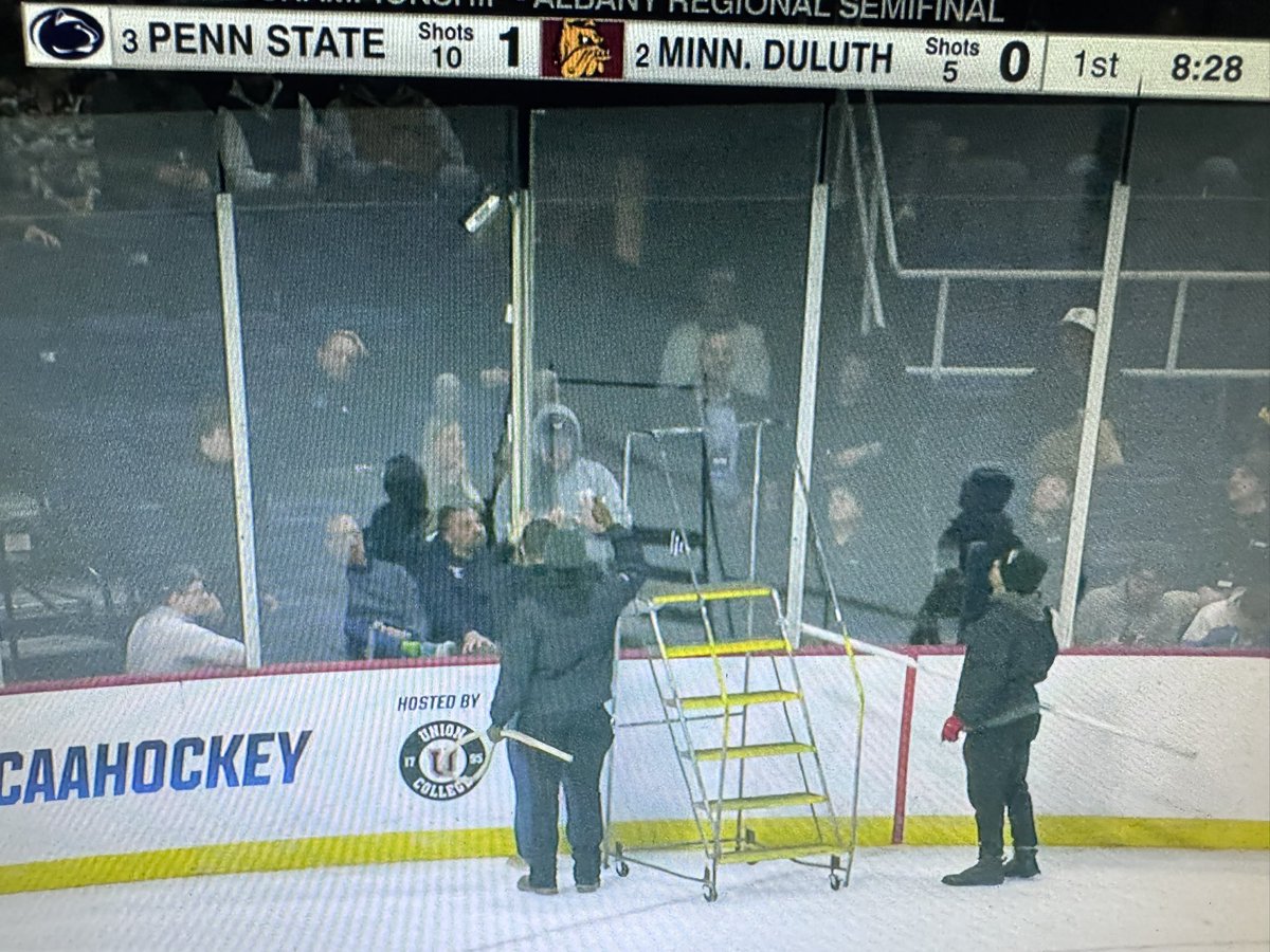 mwiseman57's tweet photo. First issues with the glass in the Michigan State game, now glass issues during Penn State vs Minn. Duluth. NCAA hockey plays so hard apparently they can’t keep the plexiglass together! https://t.co/BCdaFy5nKb