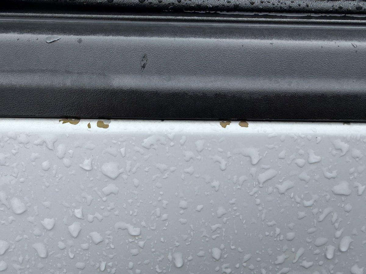 StewPup's tweet photo. @Ford @jimfarley98: The paint is falling off of my 2019 F-150 with only 74k miles on it due to a factory paint defect in the e-coat process of the painting. That’s bare primer that’s exposed and the paint around it is not bonded and literally flaking away. https://t.co/SAzsITEuIm