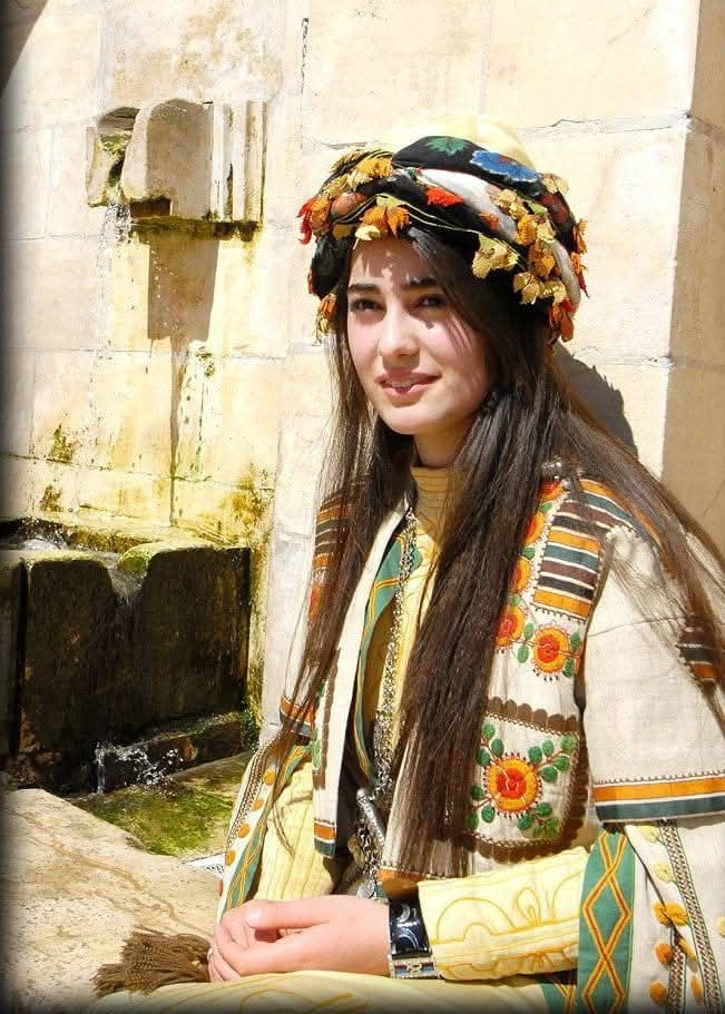 A young Kurdish woman in traditional dress, early 2000s