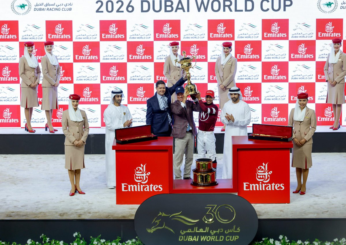 DXBMediaOffice's tweet image. Hamdan bin Mohammed presents the Dubai World Cup trophy to the winner of the main Group 1 race, Magnitude, ridden by jockey Jose Ortiz.